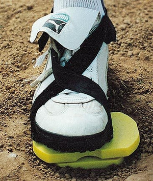 baseball player standing on Pivot Pro Baseball Hitting Trainer on field.
