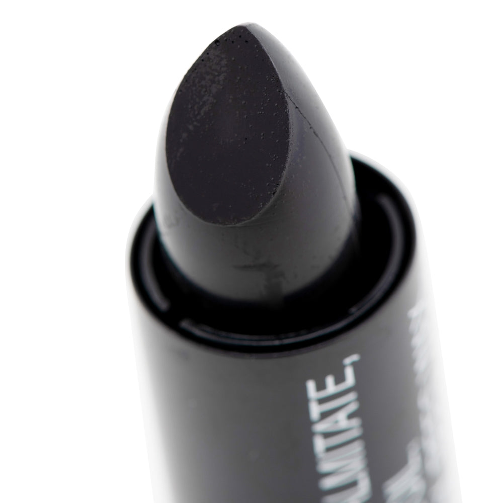 close up of tip of Black eye stick with visible branding on a white background