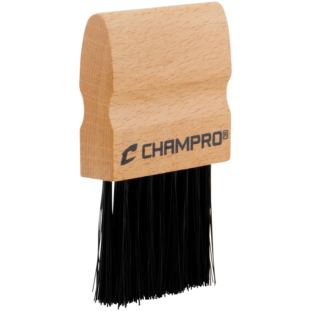 Wooden umpire brush with black bristles and 'Champro' branding on a white background