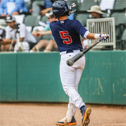 Baseball player in uniform with number 5 holding a bat with Varo ARC Bat Weight 12 Oz on bat, on a field