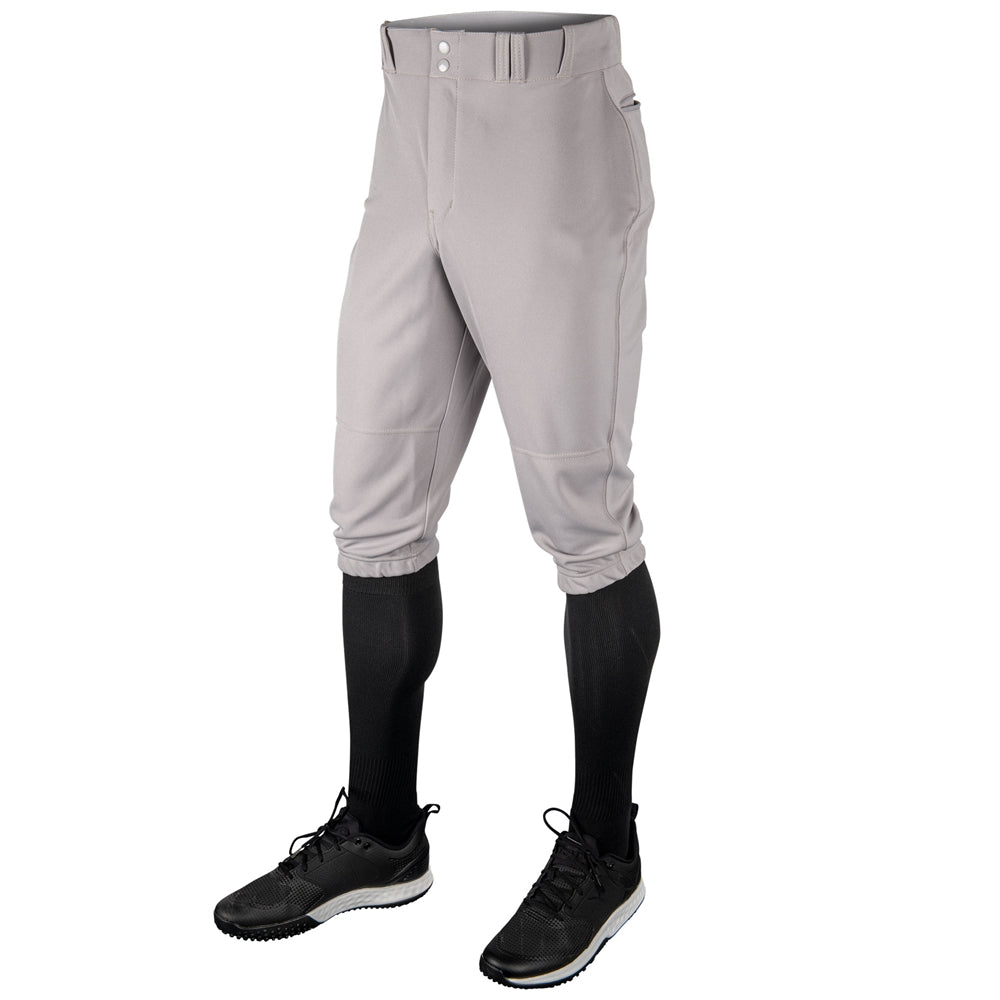 Gray softball Champro MVP Knicker pants with black shoes and socks on a white background