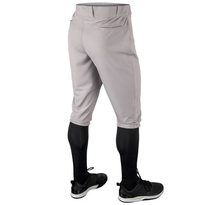 Gray softball Champro MVP Knicker pants with black socks and shoes on a white background