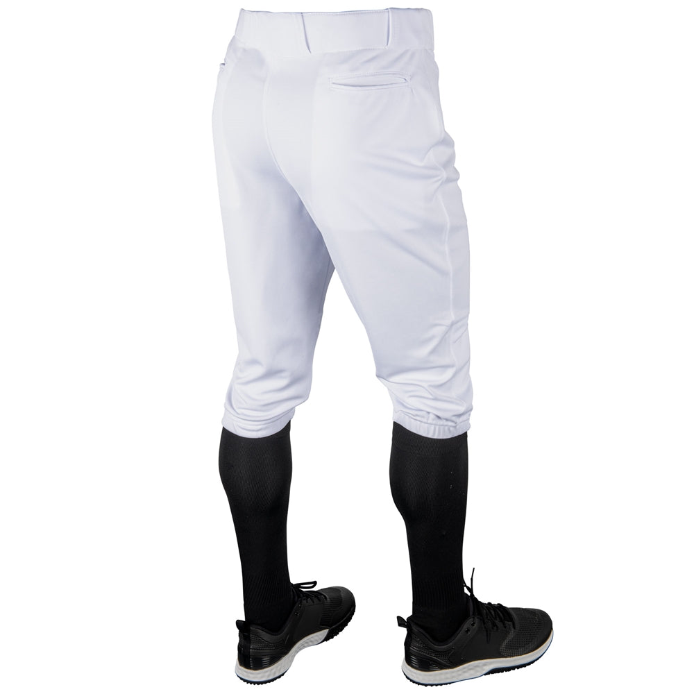 White baseball Champro MVP Knicker pants with black socks and shoes on a white background