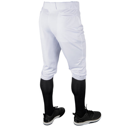 White baseball Champro MVP Knicker pants with black socks and shoes on a white background