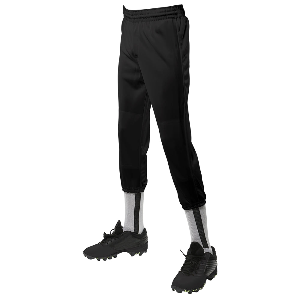 Black Champro Value Pull-Up Pant FOR Youth pants with black cleats on a white background