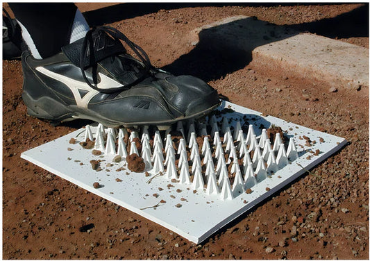 football player cleaning his shoe on Cleat Cleaner 12"x 13"