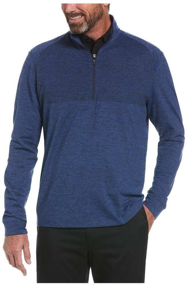 Man wearing a blue Perry Ellis Golf Men’s 1/4 Zip Performance Pullover over a white shirt on a white background